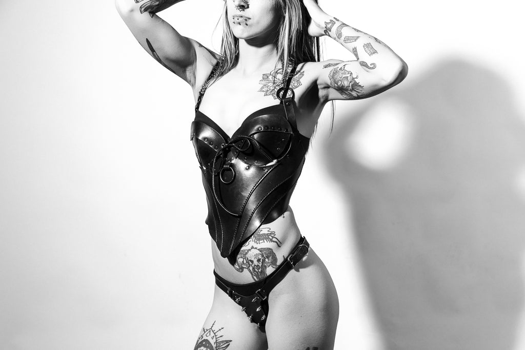 girl wearing the immortal corset and spiky thong