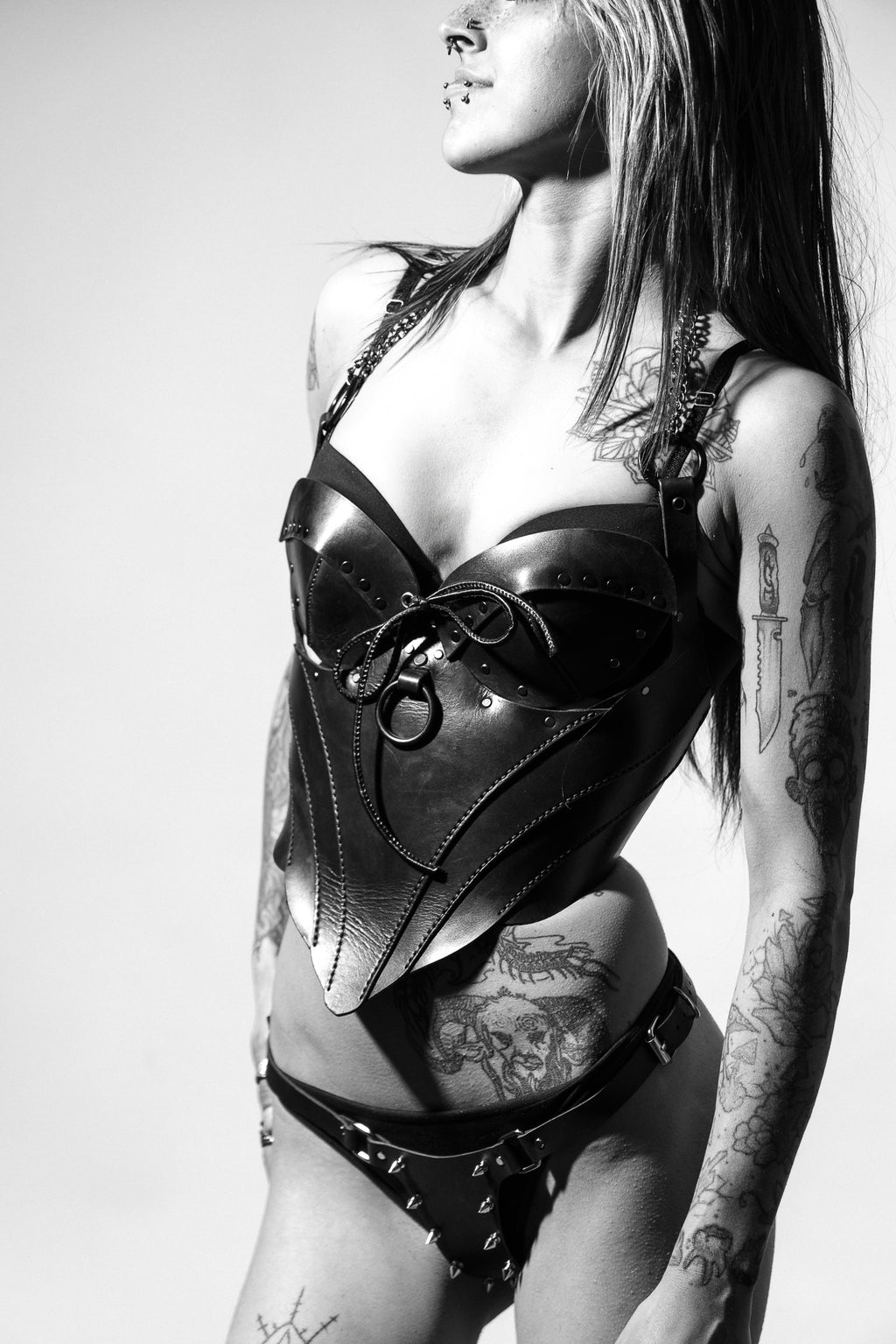 girl wearing immortal corset and spiky thong