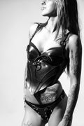 girl wearing immortal corset and spiky thong